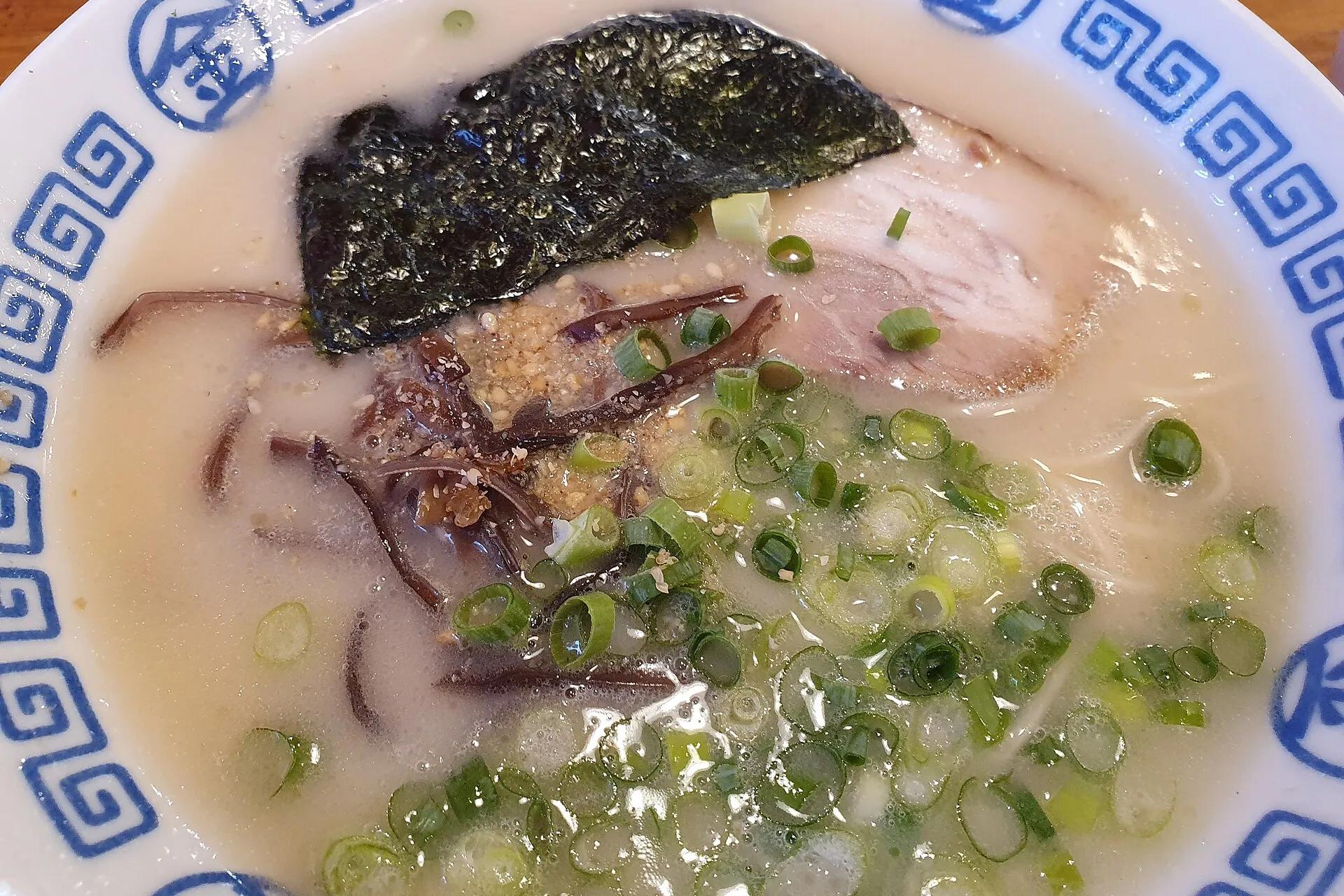 A bowl of tonkotsu ramen with seaweed, pork and spring onions in Tokyo